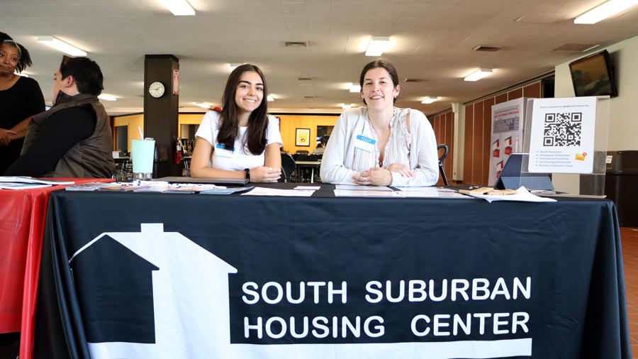 Two people at a South Suburban Housing Center table
